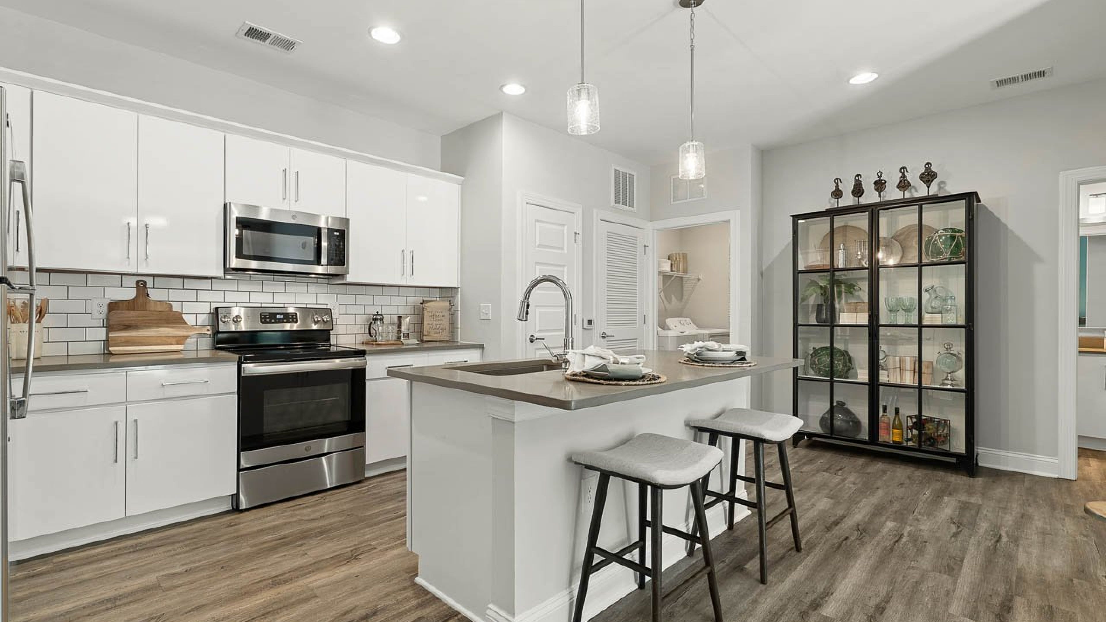 Hawthorne Waterstone apartment beautiful kitchen interior with stainless steel appliances and kitchen island